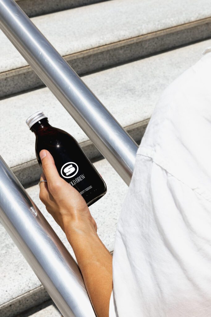 Man holding Slo cold brew coffee
